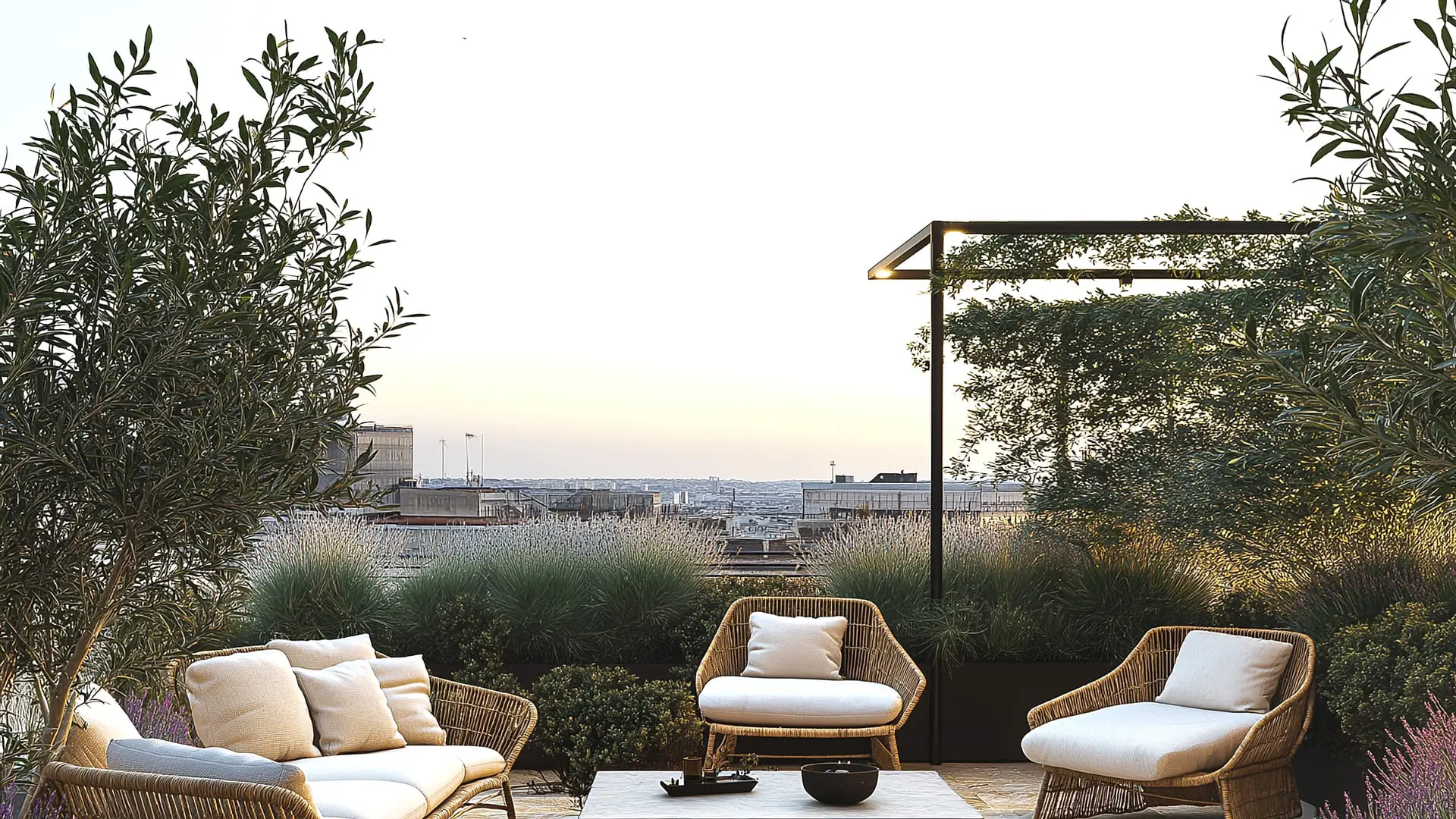 Lush exclusive rooftop terrace with lounge furniture and rich planting in Berlin at sunset